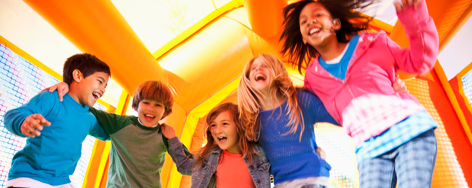 kids jumping in bounce house