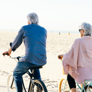 couple biking on the beach