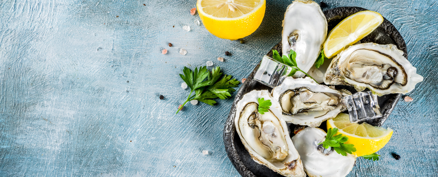 oysters on the half shell with lemon slices