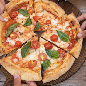 people sharing a pizza