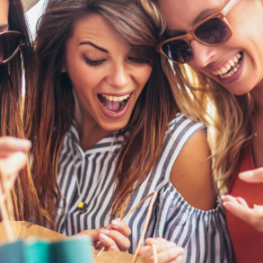 three woman with shopping bags