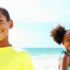 African American family walking on beach