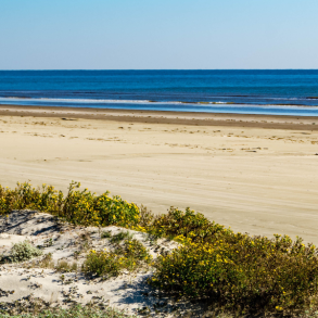 wide open beach with beautiful blue water