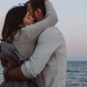 couple hugging on beach