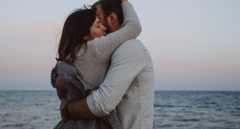 couple hugging on beach