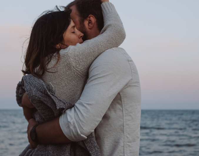 couple hugging on beach