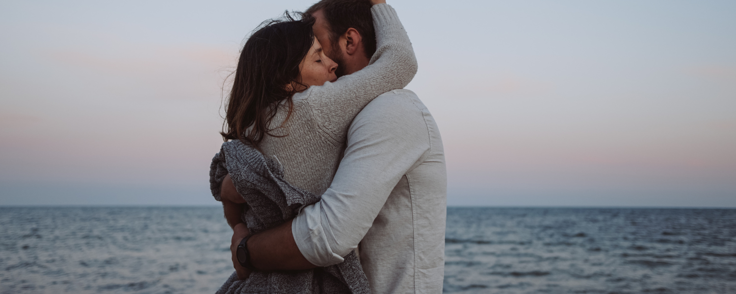 couple hugging on beach