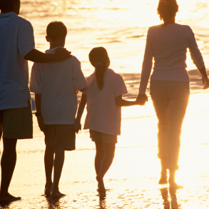family walking on beach