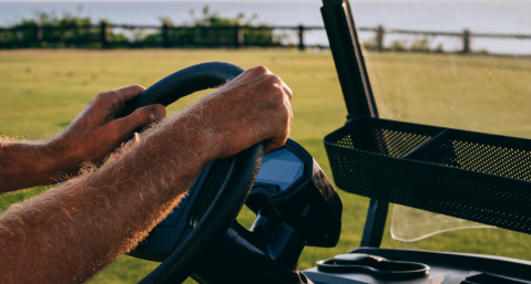 person in golf cart