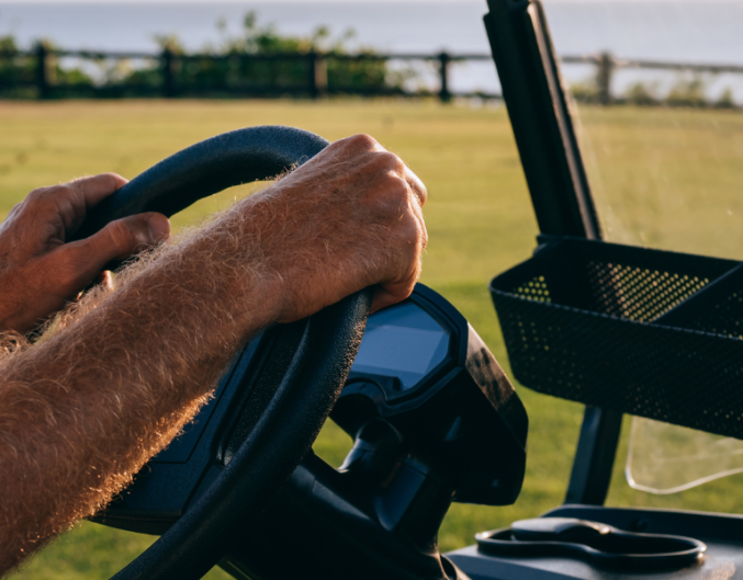 person in golf cart